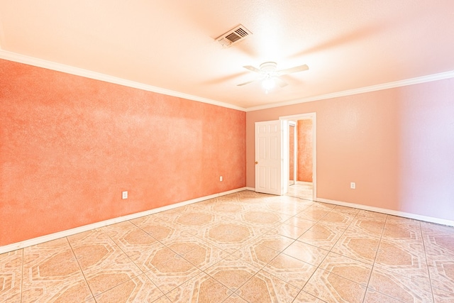 spare room featuring baseboards, ceiling fan, ornamental molding, and visible vents