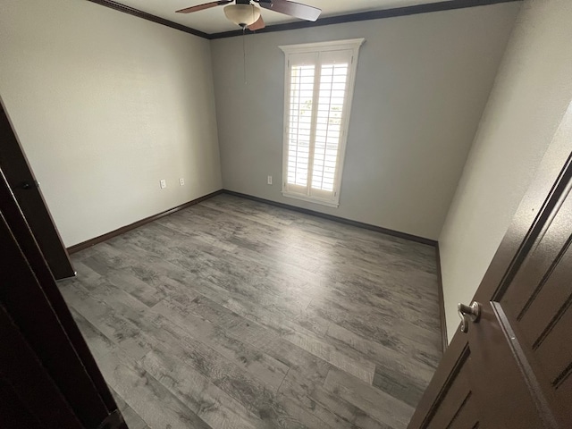 7311 Westmoore Rd, Odessa, TX 79764 - spare room with a ceiling fan, crown molding, and wood finished floors