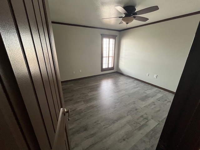 7311 Westmoore Rd, Odessa, TX 79764 - unfurnished room featuring crown molding, ceiling fan, and wood finished floors