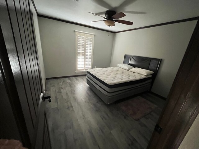 7311 Westmoore Rd, Odessa, TX 79764 - bedroom with crown molding, wood finished floors, and a ceiling fan