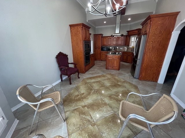 7311 Westmoore Rd, Odessa, TX 79764 - kitchen featuring stainless steel appliances, ornamental molding, a chandelier, brown cabinetry, and a kitchen island
