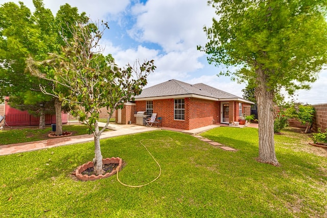 401 Brookover Cir, Odessa, TX 79763 - back of property featuring a fenced backyard, a patio, and brick siding