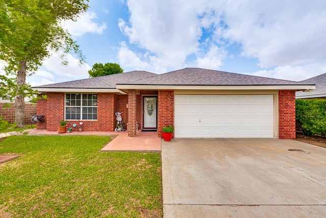 401 Brookover Cir, Odessa, TX 79763 - view of front of house with driveway, a garage, and brick siding