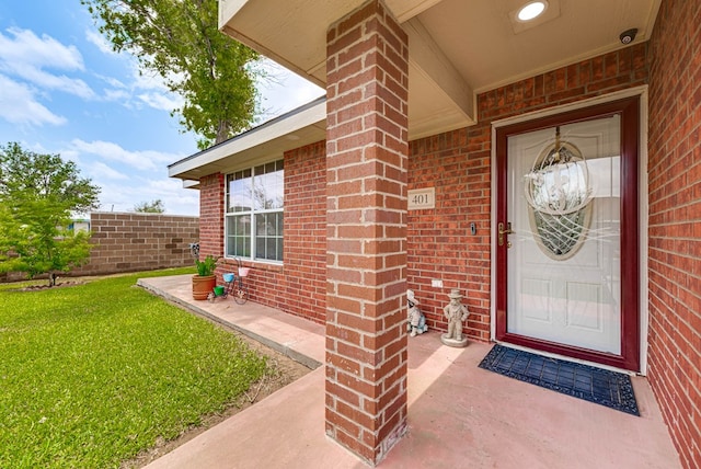 401 Brookover Cir, Odessa, TX 79763 - property entrance with brick siding and a yard