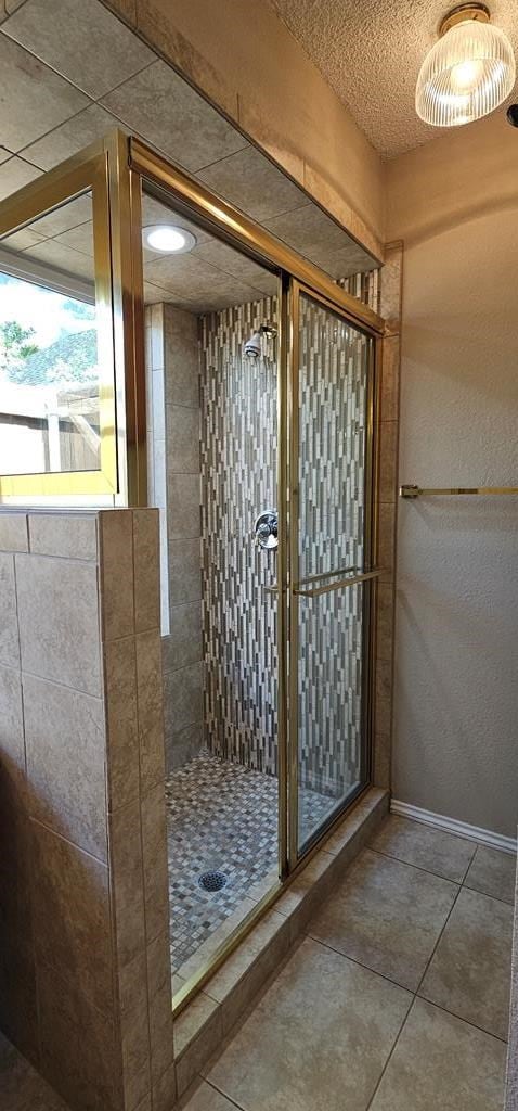2304 Regal Pl, Midland, TX 79707 - bathroom with a shower stall and tile patterned floors