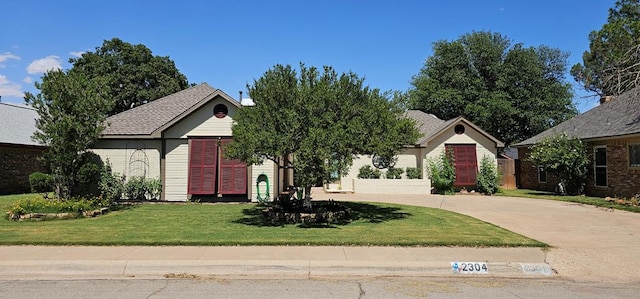 2304 Regal Pl, Midland, TX 79707 - view of front of house with driveway and a front yard