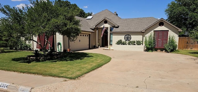 2304 Regal Pl, Midland, TX 79707 - view of front facade with driveway, an attached garage, and brick siding