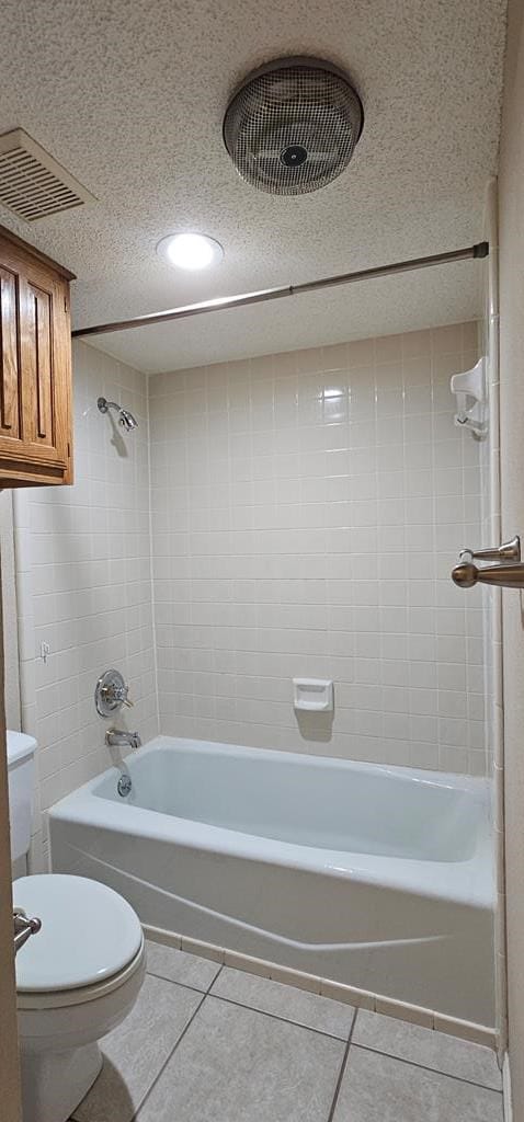 2304 Regal Pl, Midland, TX 79707 - bathroom featuring tile patterned floors, shower / bathtub combination, and toilet