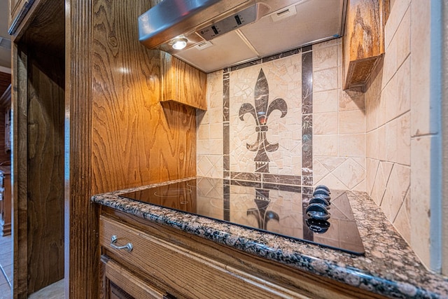 104 Waimea Dr, Odessa, TX 79762 - detailed view of premium range hood and black electric stovetop