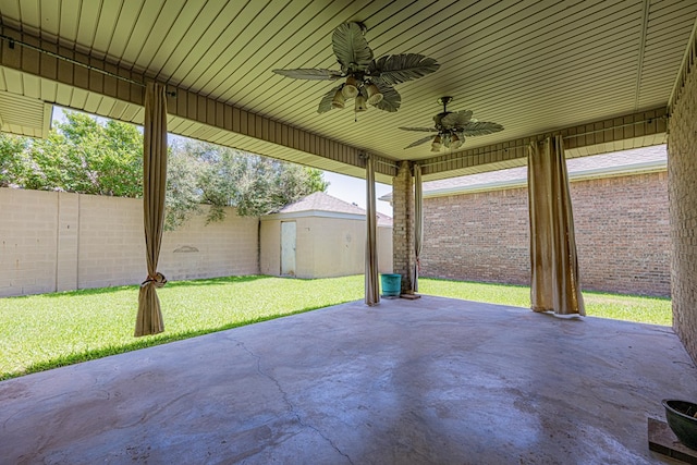 104 Waimea Dr, Odessa, TX 79762 - fenced backyard with ceiling fan and a patio