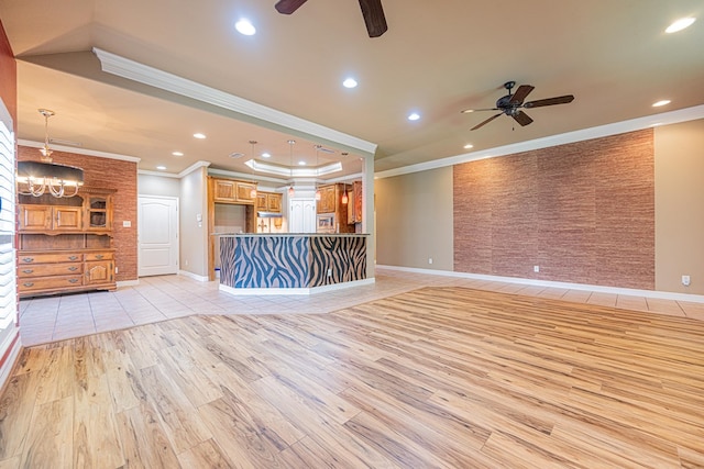 104 Waimea Dr, Odessa, TX 79762 - unfurnished living room with a ceiling fan, light wood-type flooring, crown molding, recessed lighting, and a raised ceiling