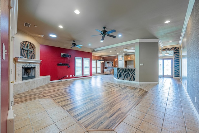 104 Waimea Dr, Odessa, TX 79762 - unfurnished living room featuring recessed lighting, ceiling fan, light tile patterned flooring, healthy amount of natural light, and crown molding
