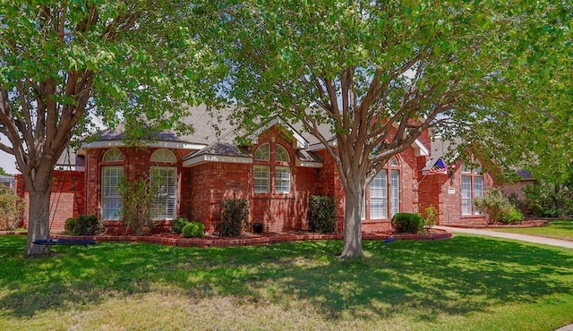 7 Amethyst Cv, Odessa, TX 79762 - view of front of house with brick siding and a front lawn