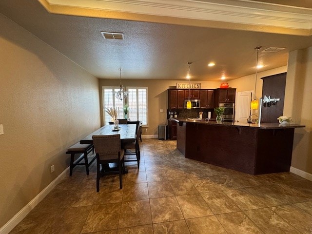 6111 Sun Tea Way, Midland, TX 79705 - dining room featuring a chandelier and baseboards