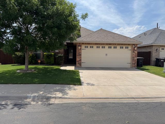 6111 Sun Tea Way, Midland, TX 79705 - ranch-style home with a front lawn, a garage, driveway, and brick siding