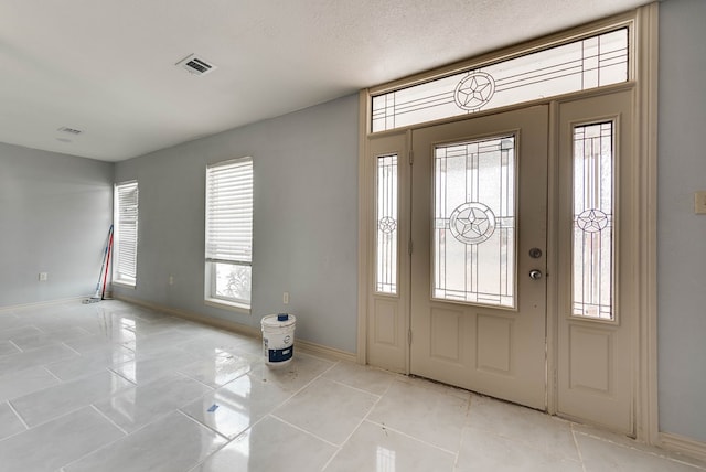 1009 S Terrell St, Midland, TX 79701 - foyer with baseboards and light tile patterned floors