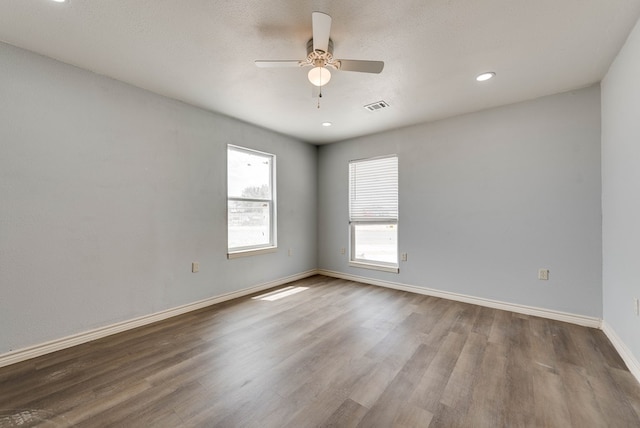 1009 S Terrell St, Midland, TX 79701 - unfurnished room with wood finished floors, a ceiling fan, and recessed lighting