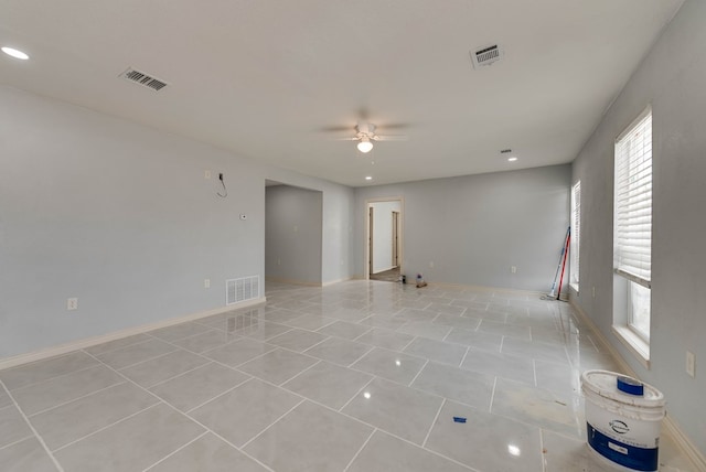 1009 S Terrell St, Midland, TX 79701 - unfurnished room with plenty of natural light, ceiling fan, light tile patterned flooring, and recessed lighting