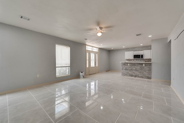 1009 S Terrell St, Midland, TX 79701 - unfurnished living room featuring a ceiling fan, light tile patterned flooring, and recessed lighting