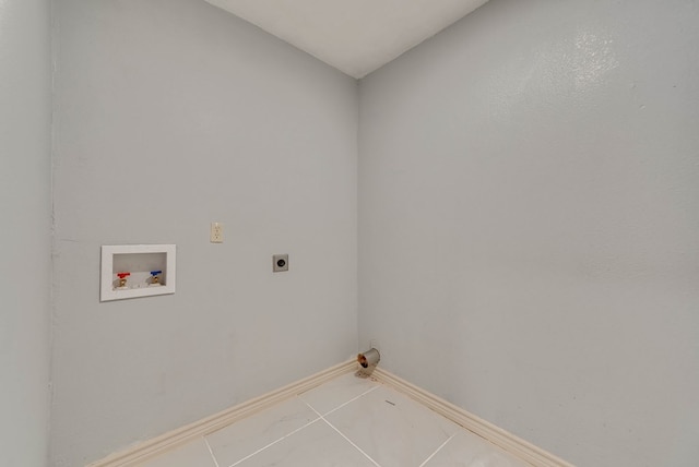 1009 S Terrell St, Midland, TX 79701 - washroom with electric dryer hookup, hookup for a washing machine, and tile patterned floors