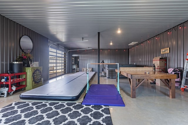 3398 SE 3000, Andrews, TX 79714 - rec room with finished concrete floors and a garage
