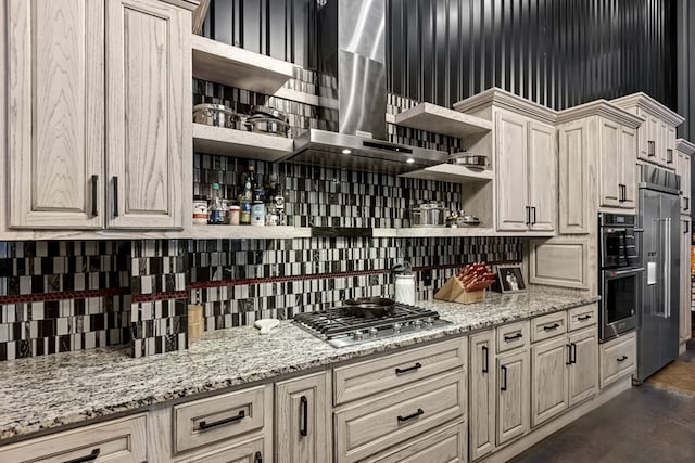 3398 SE 3000, Andrews, TX 79714 - kitchen featuring open shelves, backsplash, appliances with stainless steel finishes, wall chimney exhaust hood, and light stone countertops