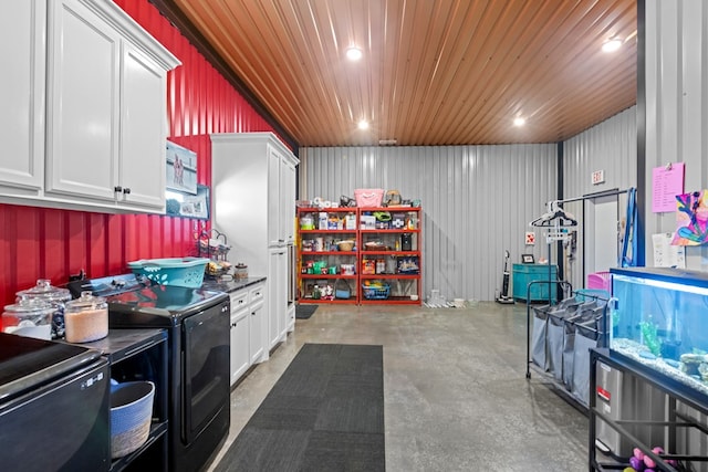 3398 SE 3000, Andrews, TX 79714 - kitchen featuring washing machine and dryer, concrete floors, white cabinets, dark countertops, and recessed lighting
