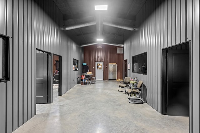 3398 SE 3000, Andrews, TX 79714 - hallway with concrete floors and a high ceiling