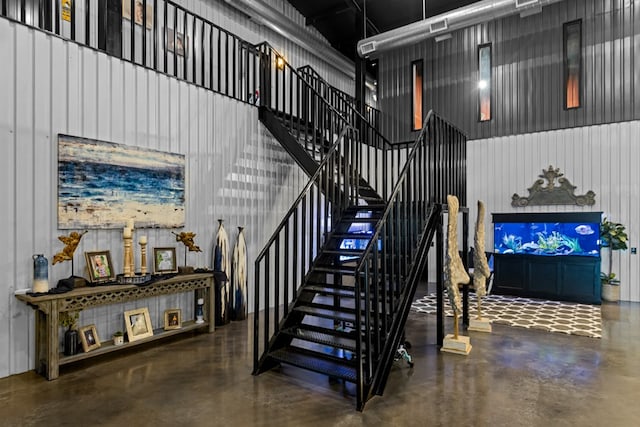 3398 SE 3000, Andrews, TX 79714 - stairs with finished concrete flooring and a high ceiling