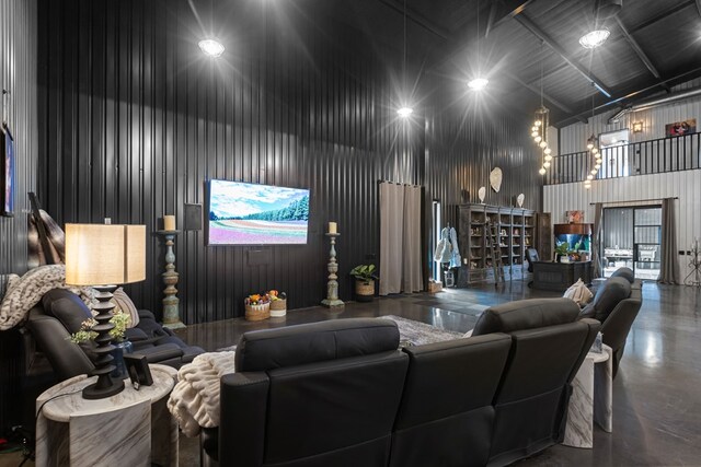 3398 SE 3000, Andrews, TX 79714 - living area featuring a towering ceiling and concrete flooring