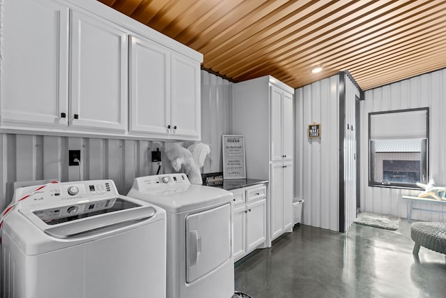 3398 SE 3000, Andrews, TX 79714 - washroom with cabinet space, washer and clothes dryer, and wooden ceiling