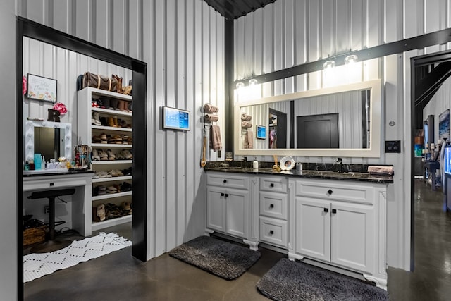 3398 SE 3000, Andrews, TX 79714 - bathroom with finished concrete floors and double vanity