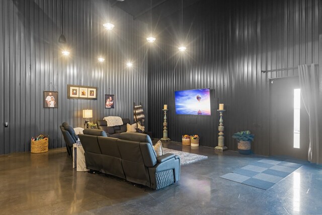 3398 SE 3000, Andrews, TX 79714 - living room featuring a towering ceiling and concrete flooring