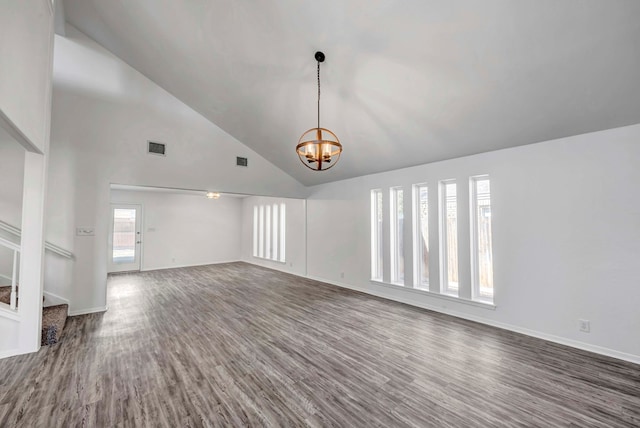 unfurnished living room with an inviting chandelier, stairs, visible vents, and dark wood finished floors