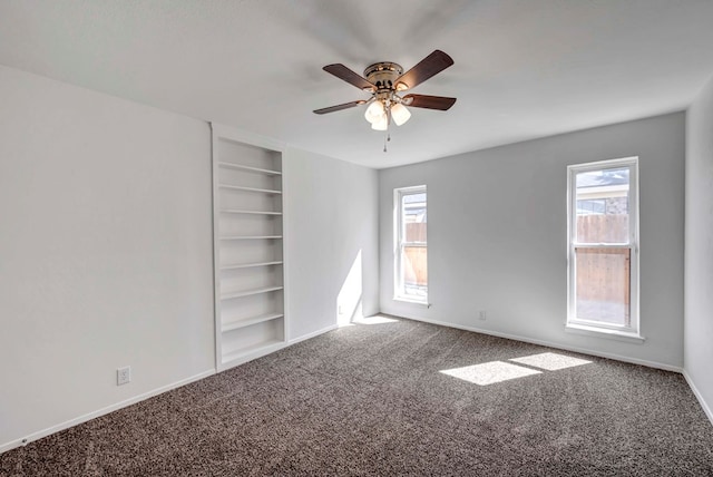 unfurnished bedroom featuring carpet, baseboards, and ceiling fan