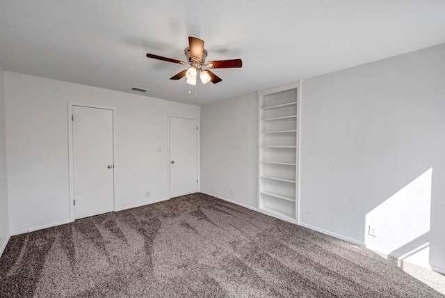 unfurnished bedroom with ceiling fan, carpet flooring, and visible vents