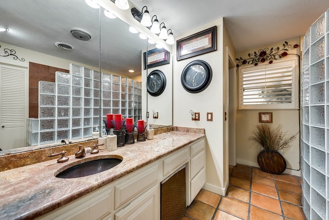 2919 Kirkwood Dr, Odessa, TX 79762 - full bath featuring vanity, a walk in shower, and tile patterned flooring