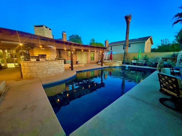 2919 Kirkwood Dr, Odessa, TX 79762 - view of pool featuring exterior kitchen, a patio area, a fenced backyard, and a pool with connected hot tub
