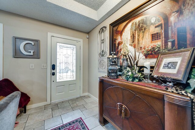 2919 Kirkwood Dr, Odessa, TX 79762 - entrance foyer with baseboards and a textured ceiling
