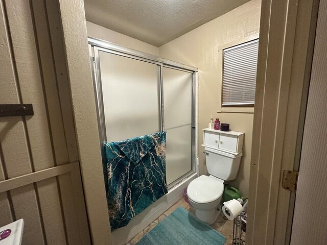 2919 Kirkwood Dr, Odessa, TX 79762 - full bathroom featuring a shower stall and a textured ceiling