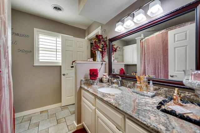 2919 Kirkwood Dr, Odessa, TX 79762 - full bath with vanity and stone tile flooring