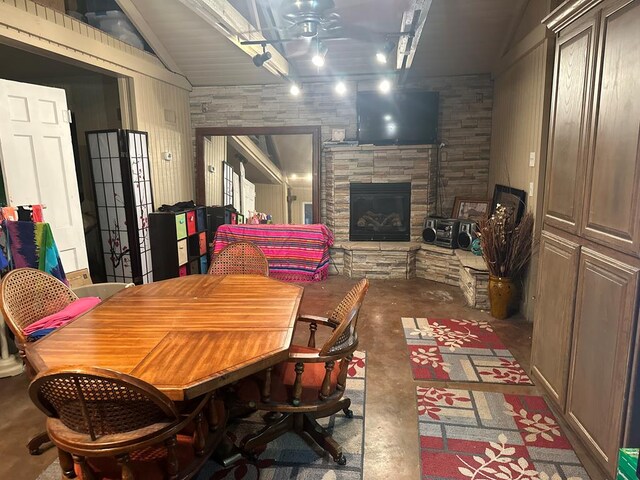 2919 Kirkwood Dr, Odessa, TX 79762 - dining room featuring unfinished concrete floors, lofted ceiling, and a glass covered fireplace