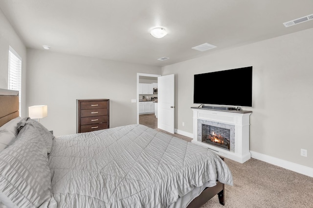 bedroom featuring visible vents, baseboards, and carpet floors