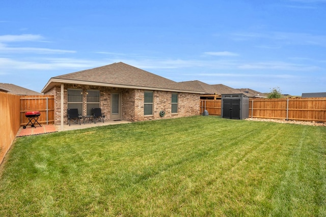 rear view of property featuring a fenced backyard, a patio area, a storage shed, and a yard