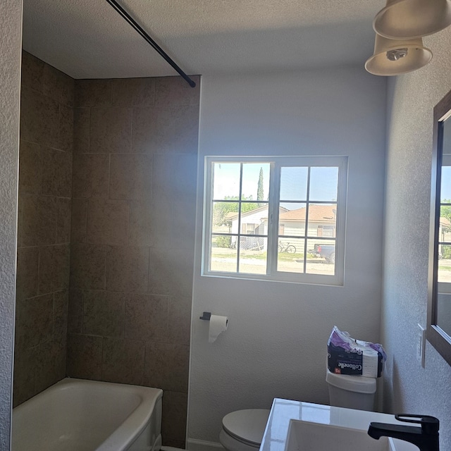 1310 S Emerson Ave, Mccamey, TX 79752 - full bath with toilet, bathing tub / shower combination, and a sink
