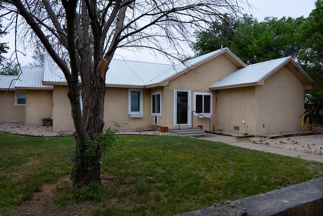 302 County Rd 409, Seminole, TX 79714 - view of front facade with metal roof, stucco siding, and a front yard