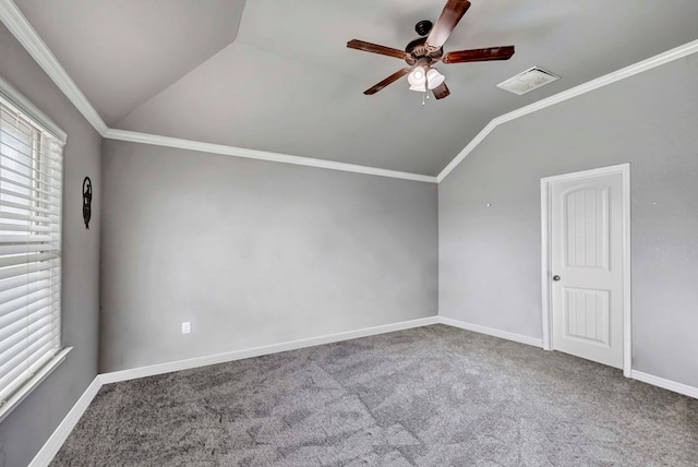 spare room featuring carpet floors, ceiling fan, vaulted ceiling, and a wealth of natural light