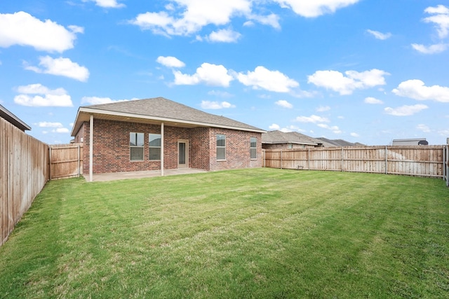8919 Red Cliff Ave, Odessa, TX 79765 - back of property with brick siding, a patio, a fenced backyard, and roof with shingles