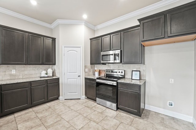 8919 Red Cliff Ave, Odessa, TX 79765 - kitchen with appliances with stainless steel finishes, backsplash, light stone counters, ornamental molding, and light tile patterned floors