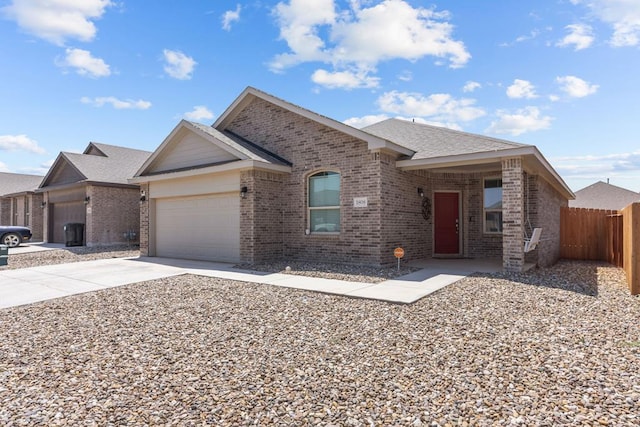 1808 Ebbets Dr, Odessa, TX 79762 - ranch-style house featuring brick siding, a garage, driveway, and roof with shingles
